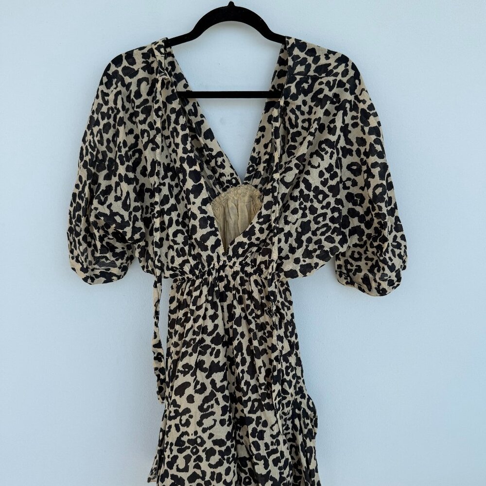 Leopard print mini dress with puff sleeves and an open back